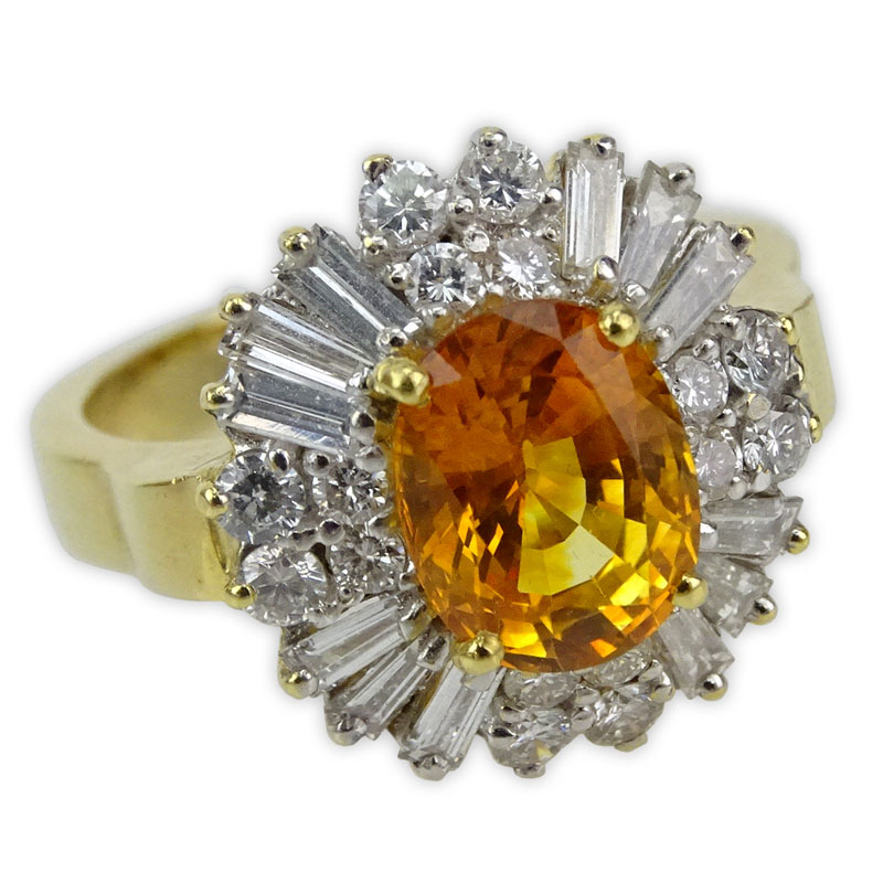 3.89 Carat Oval Cut Orange Sapphire, 1.50 Carat Round Brilliant and Baguette Cut Diamond and 18 Karat Yellow Gold Ring. 