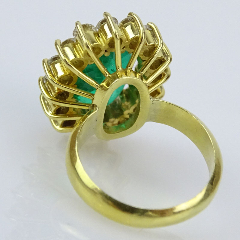 Oval Cut Brazilian Emerald, Approx. 4.15 Carat Round Brilliant Cut Diamond and 18 Karat Yellow Gold Ring. 