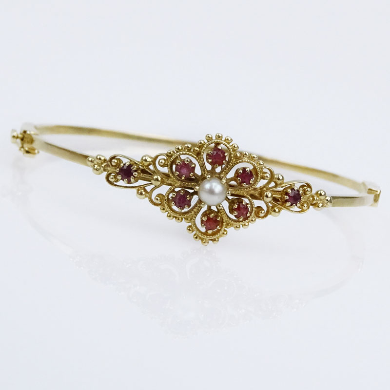 Vintage 14 Karat Yellow Gold Hinged Bangle Bracelet with Round Cut Rubies and White Pearls