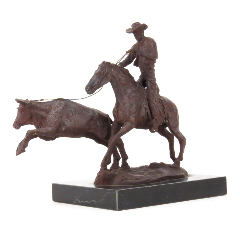 After: C.M. Russell, American (1864-1926) "Cowboy Roping Bull" Bronze Sculpture on Black Marble Base. 