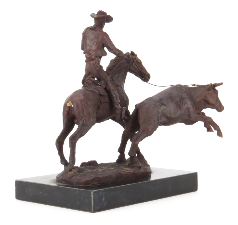 After: C.M. Russell, American (1864-1926) "Cowboy Roping Bull" Bronze Sculpture on Black Marble Base. 