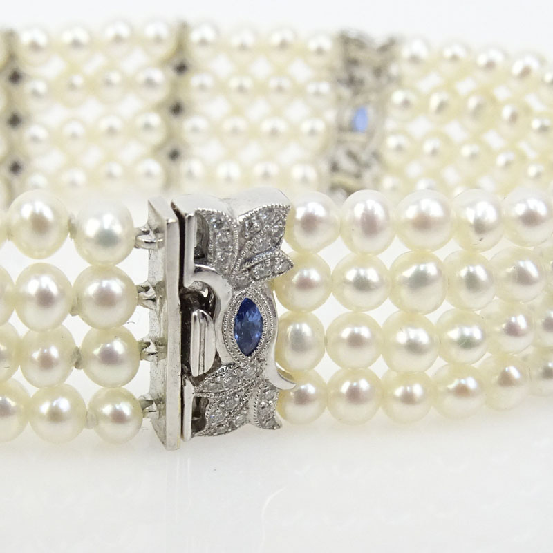 Four Strand Pearl, Approx. .40 Carat Diamond and 18 Karat White Gold Bracelet 