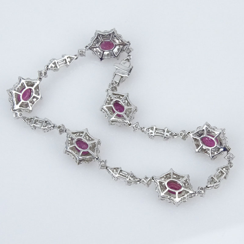 5.0 Carat Oval Cut Ruby, 4.75 Carat Round Brilliant and Baguette Cut Diamond and 18 Karat White Gold Bracelet.