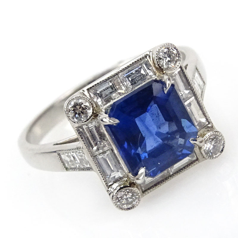 2.35 Carat Octagonal Cut Sapphire, 1.35 carat Baguette and Round Brilliant Cut Diamond and Platinum Ring. 