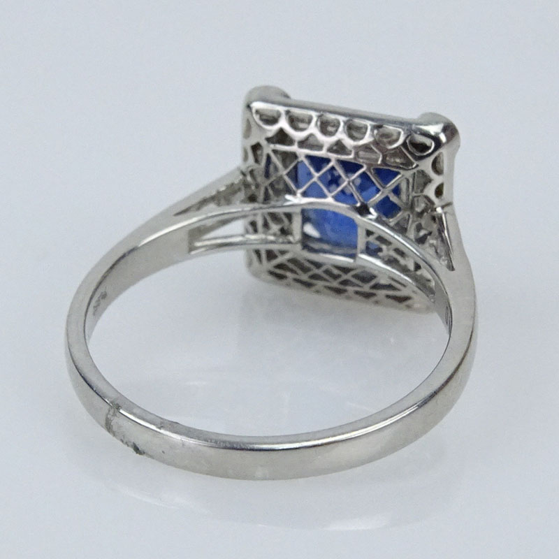 2.35 Carat Octagonal Cut Sapphire, 1.35 carat Baguette and Round Brilliant Cut Diamond and Platinum Ring. 