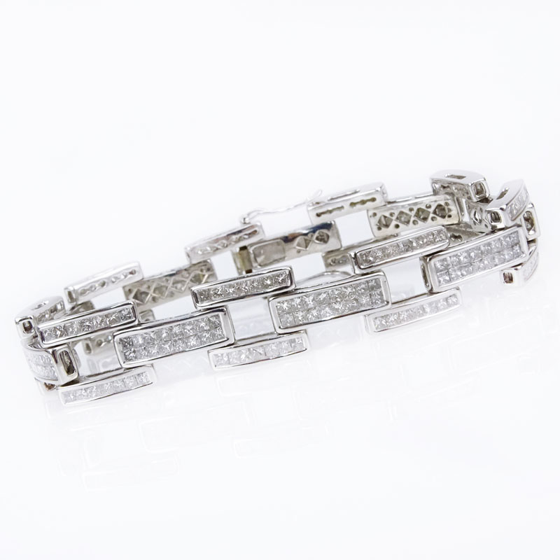 11.75 Carat Invisible Set Square Cut Diamond and 14 Karat White Gold Bracelet.