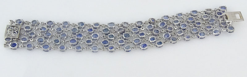 56.50 Carat Oval Cut Sapphire, 3.60 Carat Round Brilliant Cut Diamond and 18 Karat White Gold Bracelet. 