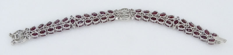 41.50 Carat Oval Cut Burma Ruby, 4.35 Carat Round Brilliant Cut Diamond and 18 Karat White Gold Bracelet. 