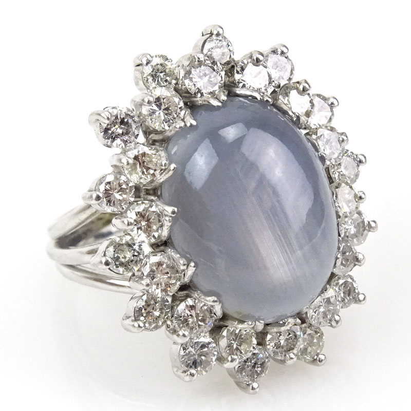 15.0-20.0 Carat Oval Cabochon Star Sapphire, 4.0 Carat Round Brilliant Cut Diamond and 14 Karat White Gold Ring. 