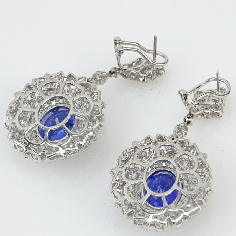 12.0 Carat Oval Cut Tanzanite, 6.0 Carat Round Brilliant Cut Diamond and 18 Karat White Gold Pendant Earrings. 