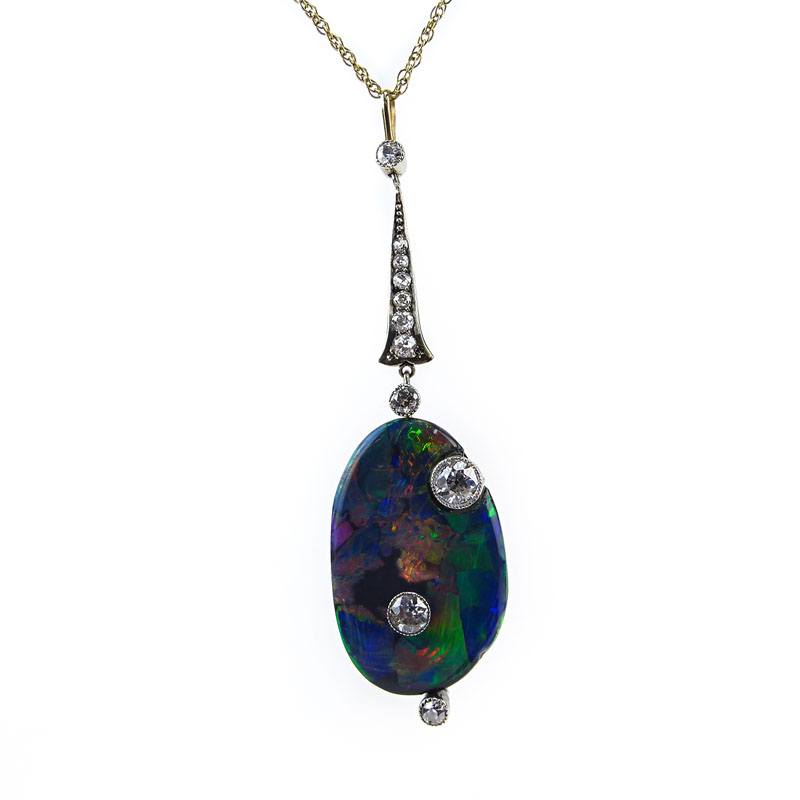 Art Nouveau Australian Free Formed Black Opal, European Cut Diamond, Platinum and 14 Karat Yellow Gold Pendant with 14 Karat Yellow Gold Chain