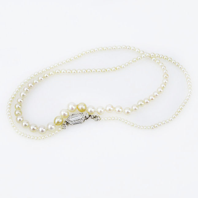 Exquisite Cartier GIA Certified Art Deco Graduated Natural Saltwater Pearl Necklace with Platinum and Diamond Clasp