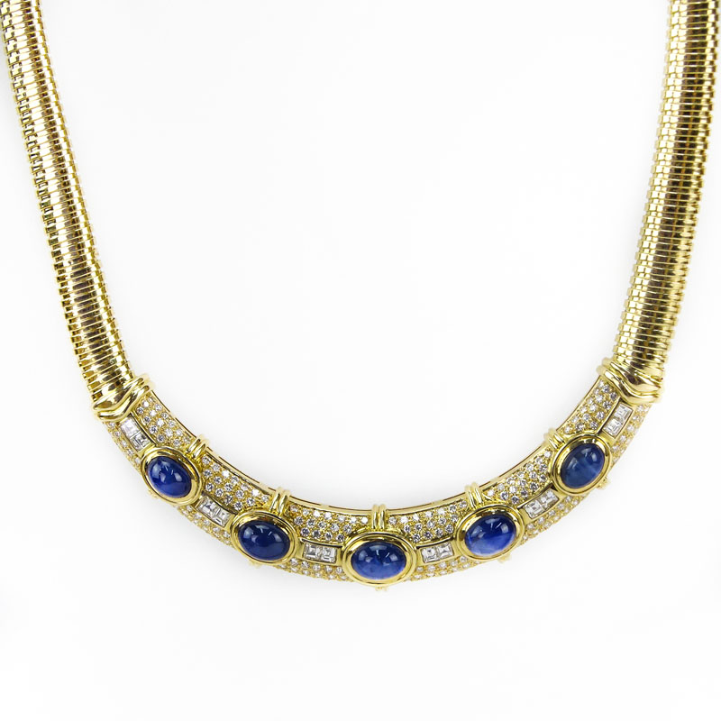 20.0 Carat Oval Cabochon Sapphire, 8.0 Carat Emerald Cut and Round Brilliant Cut Diamond and 18 Karat yellow Gold Necklace.