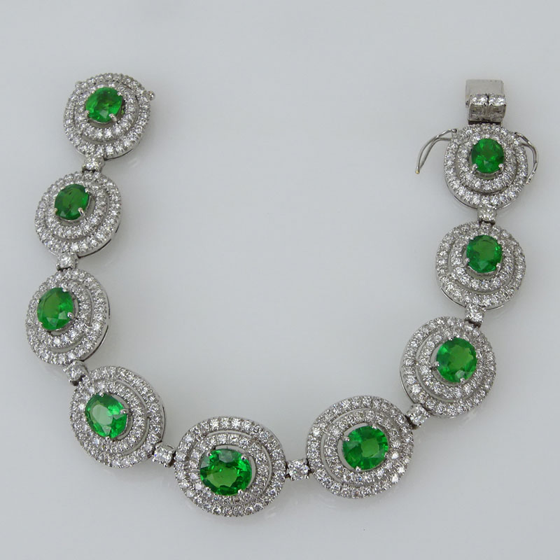 10.43 Carat Oval Cut Tsavorite Garnet, 6.55 Karat Round Brilliant Cut Diamond and 18 Karat White Gold Bracelet. 