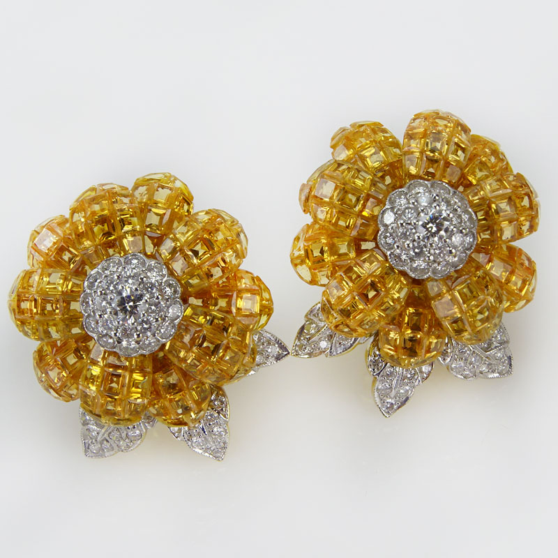 43.0 Carat Invisible Set Square Cut Yellow Sapphire, 1.25 Carat Round Brilliant Cut Diamond and 18 Karat Yellow Gold Earrings. 