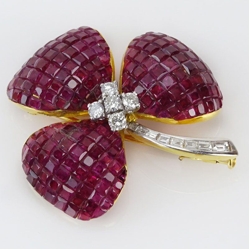  32.50 Carat Invisible Set Square Cut Ruby, .58 Carat Diamond and 18 Karat Yellow Gold Flower Brooch.