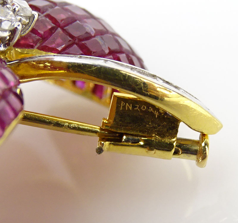  32.50 Carat Invisible Set Square Cut Ruby, .58 Carat Diamond and 18 Karat Yellow Gold Flower Brooch.