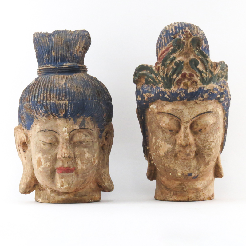 Two Chinese Polychrome Carved Buddha Heads