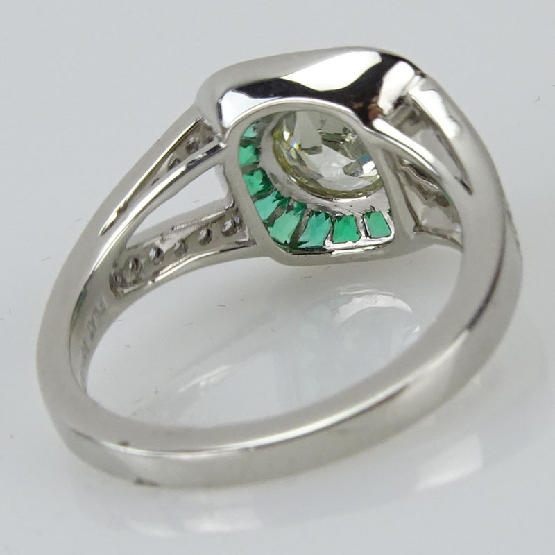 1.63 Carat TW Diamond, .55 Carat Emerald and Platinum Ring set 