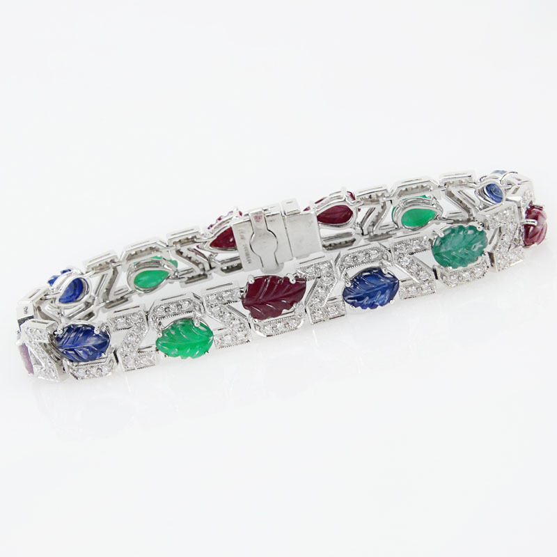 . 4.56 Carat Carved Emerald, 3.57 Carat Carved Sapphire, 5.93 Carat Carved Ruby, 1.10 Carat Round Brilliant Cut Diamond and Platinum Tutti Frutti Bracelet. 