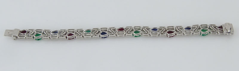 . 4.56 Carat Carved Emerald, 3.57 Carat Carved Sapphire, 5.93 Carat Carved Ruby, 1.10 Carat Round Brilliant Cut Diamond and Platinum Tutti Frutti Bracelet. 