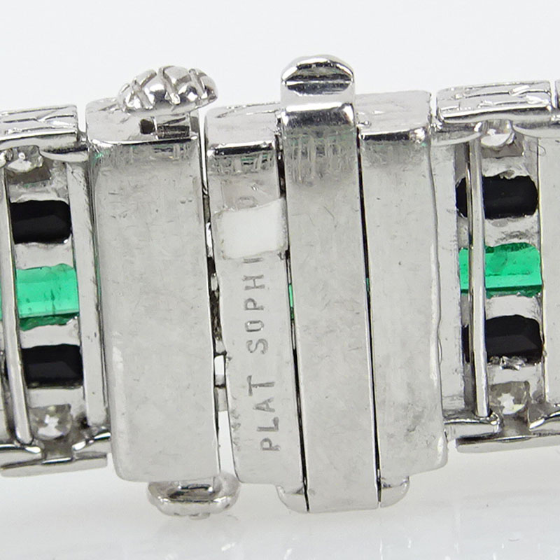 5.13 Carat Calibre Cut Emerald, 1.82 Carat Round Cut Diamond, Black Onyx and Platinum Bracelet.