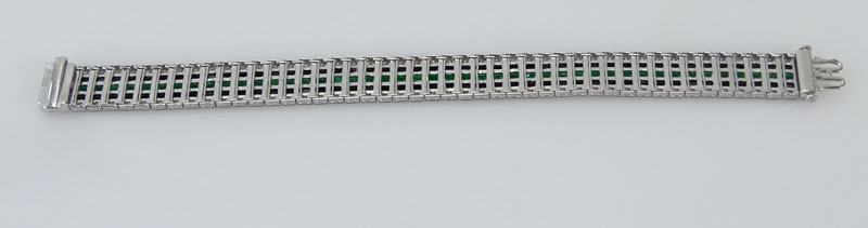 5.13 Carat Calibre Cut Emerald, 1.82 Carat Round Cut Diamond, Black Onyx and Platinum Bracelet.