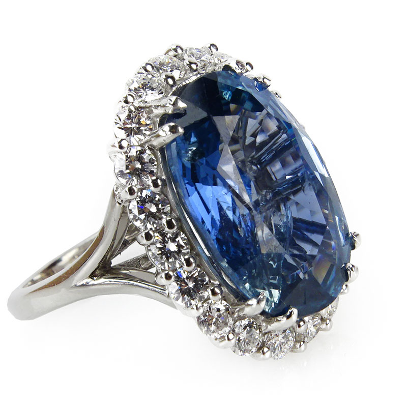 13.42 Carat Oval Cut Madagascar Sapphire, 1.40 Carat Round Brilliant Cut Diamond and Platinum Ring. 