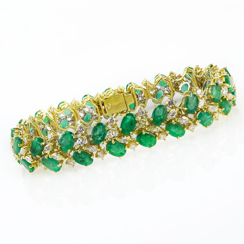 20.0 Carat Oval Cut Emerald, 3.50 Carat Round Brilliant and Marquise Cut Diamond and 18 Karat Yellow Gold Bracelet. Emeralds with vivid saturation of color. Signed 18K. 