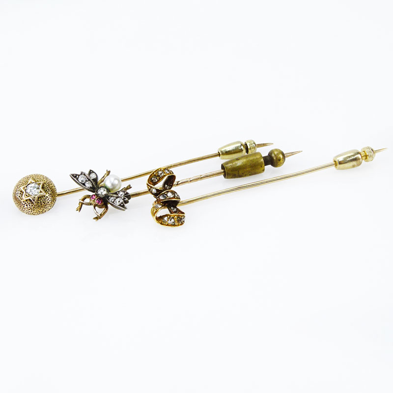 Collection of Three Victorian 10 Karat Yellow Gold Stickpins accented with Old European Cut and Mine Cut Diamonds, One with a small Pearl and Rubies