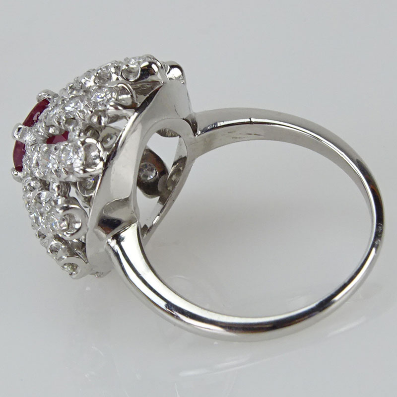 Circa 1940 Approx. 2.25 Carat Round Brilliant Cut Diamond, 1.40 Carat Round Cut Ruby and Platinum Ring