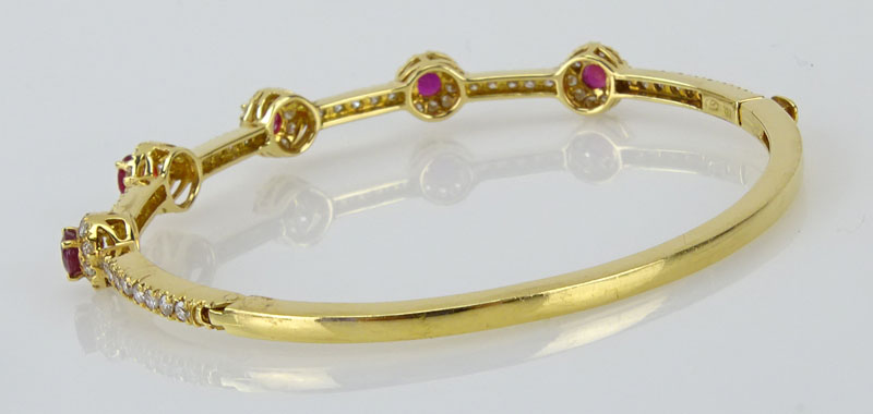 1.56 Carat Round Cut Ruby, 1.43 Carat Round Brilliant Cut Diamond and 18 Karat Yellow Gold Bangle Bracelet. 