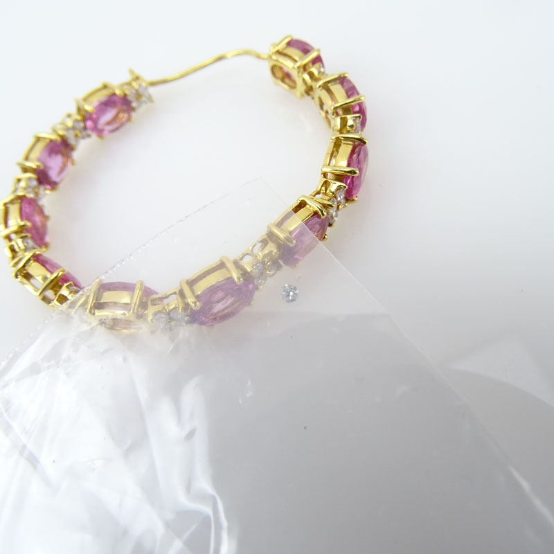 19.97 Carat Oval Cut Pink Sapphire. 1.70 Carat Round Brilliant Cut Diamond and 18 Karat Yellow Gold Hoop Earrings.