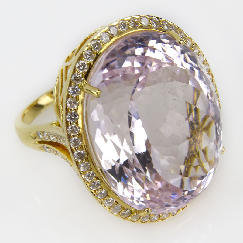 50.0 Carat Oval Cut Kunzite, 1.02 Carat Round Brilliant Cut Diamond and 18 Karat Yellow Gold Ring. 