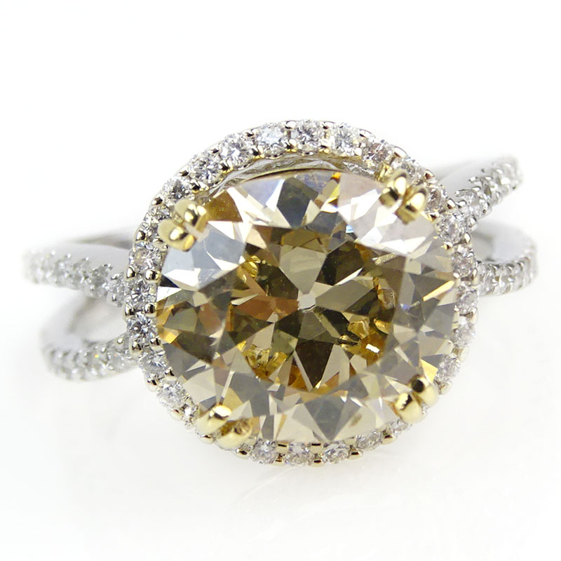 4.04 Carat Oval Brilliant Cut Fancy Brownish Yellow Diamond and 18 Karat White Gold Engagement Ring.