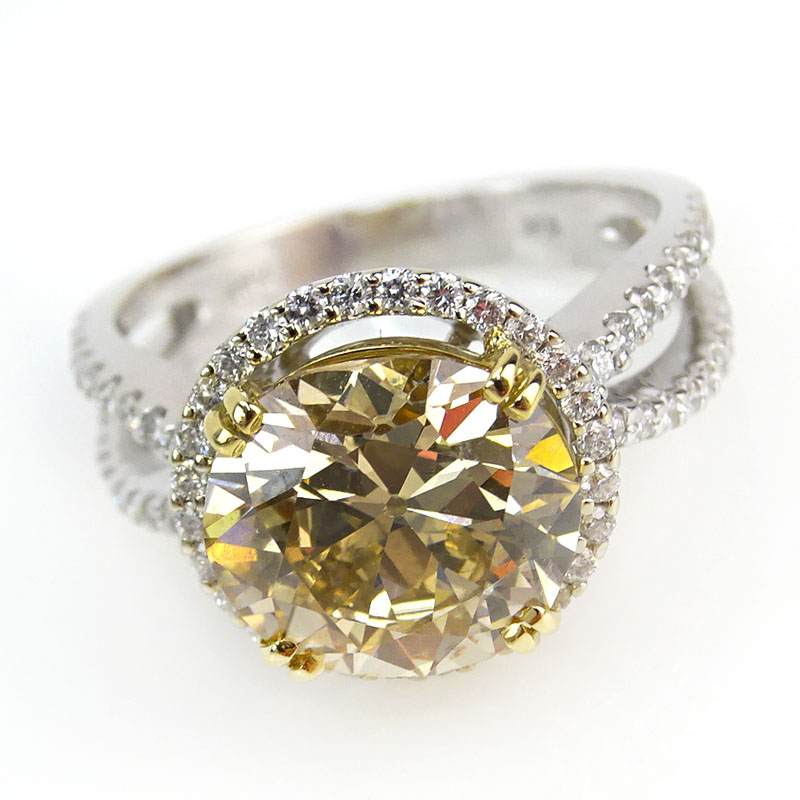 4.04 Carat Oval Brilliant Cut Fancy Brownish Yellow Diamond and 18 Karat White Gold Engagement Ring.