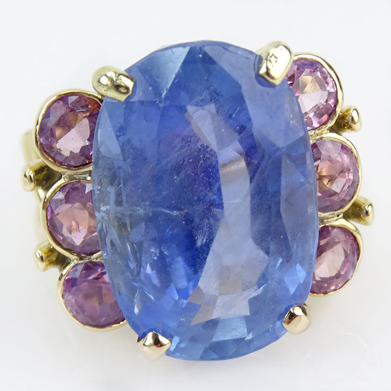 30.0 Carat Oval Cut Natural Unheated Sapphire, 1.50 Carat Round Cut Pink Sapphire and 18 Karat Yellow Gold Ring. 