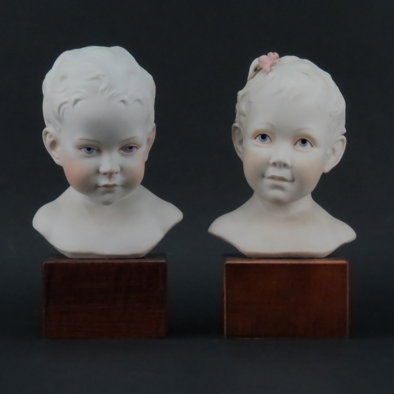 Pair of Cybis Polychrome Young Baby Boy and Girl Porcelain Busts Mounted on Wooden Bases