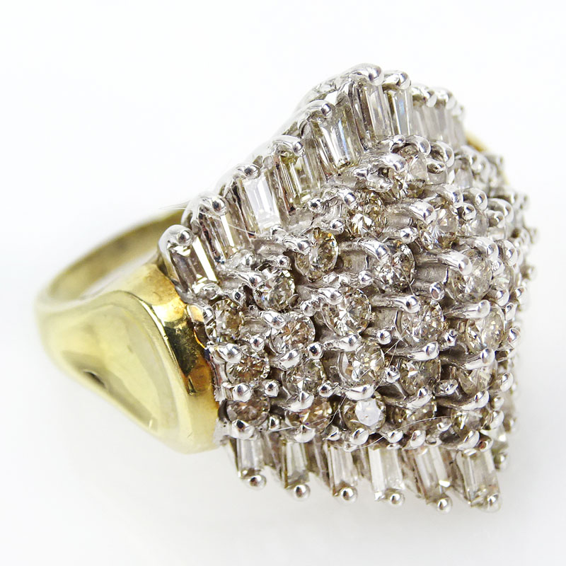 3.50 Carat Round Brilliant and Baguette Cut Diamond and 14 Karat Yellow and White Gold Ring.