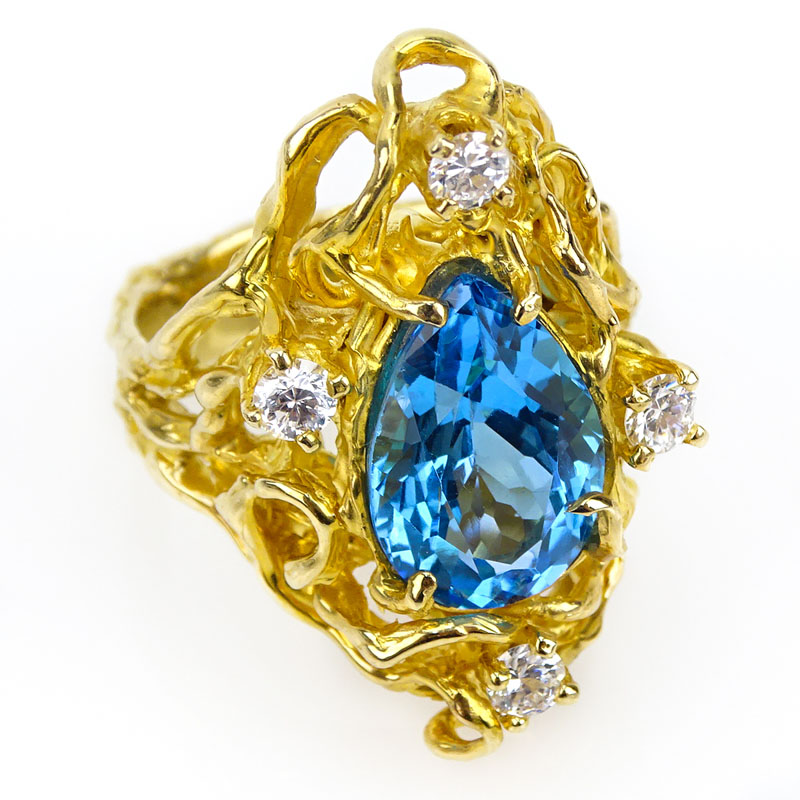 Lady's Vintage Pear Shape London Blue Topaz, Round Brilliant Cut Diamond and 14 Karat Yellow Gold Free Form Ring