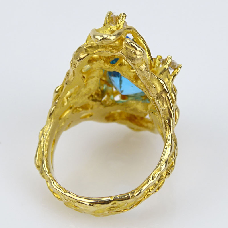 Lady's Vintage Pear Shape London Blue Topaz, Round Brilliant Cut Diamond and 14 Karat Yellow Gold Free Form Ring