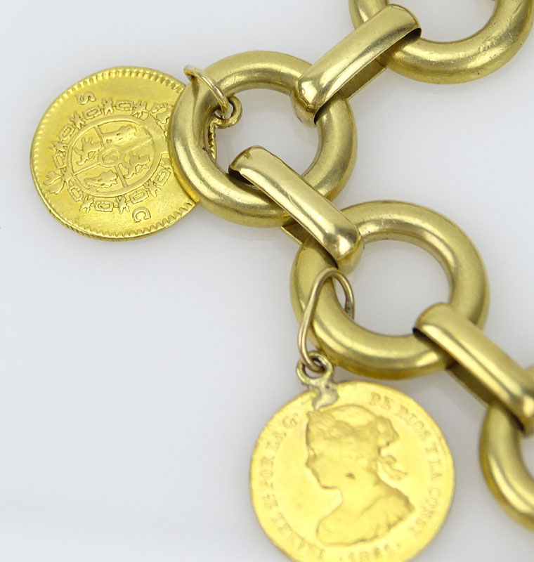 Vintage 18 Karat Yellow Gold Charm Bracelet with Seven Gold Coins Including Cuban, Mexican, Peruvian and Spanish Coins and a Reclining Man Charm