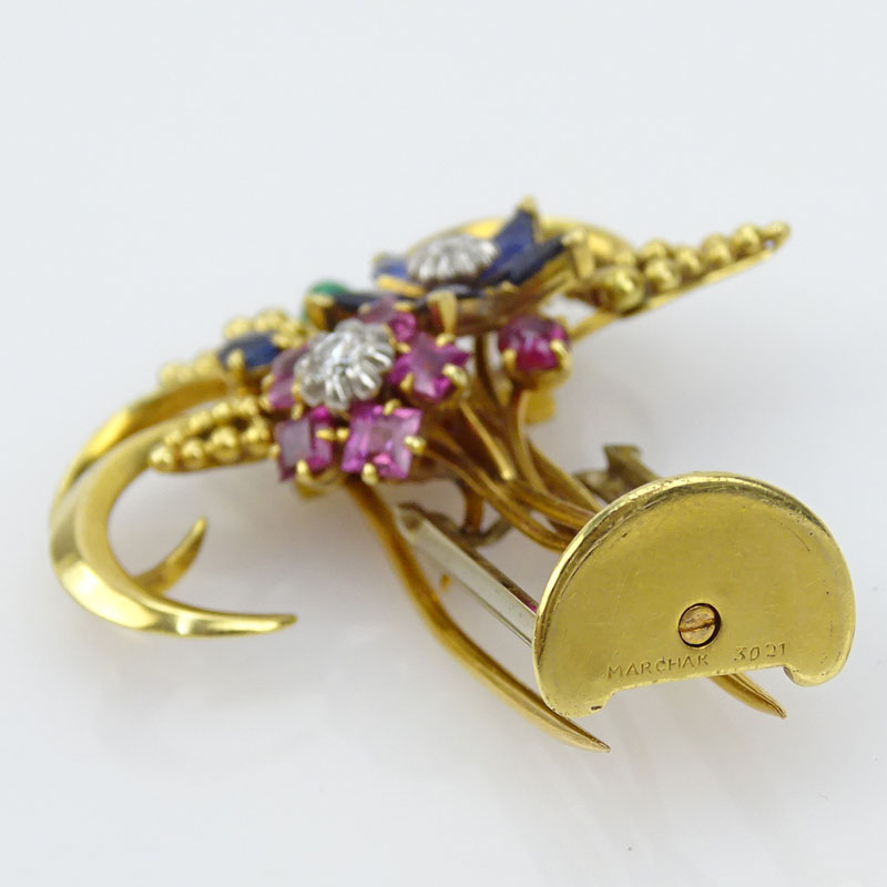 Circa 1940's 18 Karat Yellow Gold and Multi Gemstone Brooch set with Sapphires, Rubies, Emeralds and Diamonds