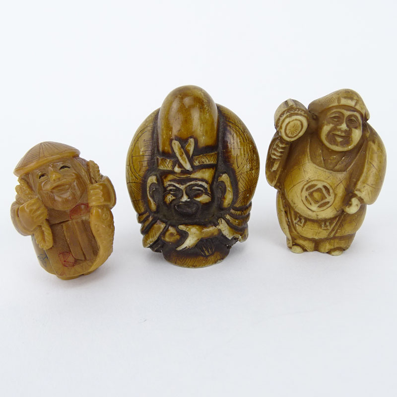 Collection of Four (4) Vintage Japanese Carved Bone Netsuke, a Carved Horn Netsuke, a Carved Horn Snuff Box and an African Iron Mask Pendant