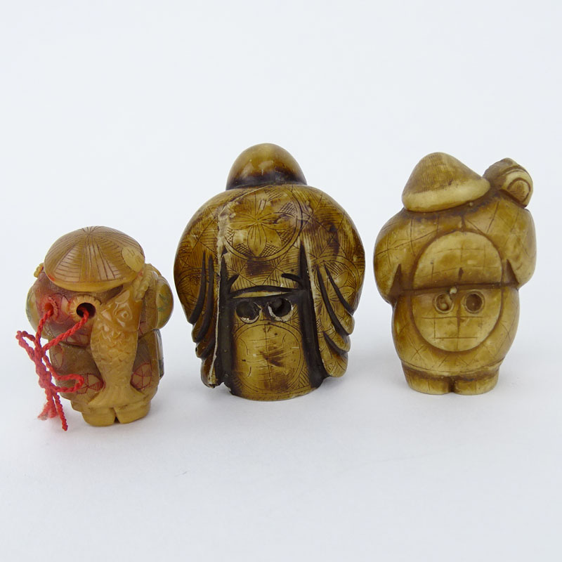 Collection of Four (4) Vintage Japanese Carved Bone Netsuke, a Carved Horn Netsuke, a Carved Horn Snuff Box and an African Iron Mask Pendant