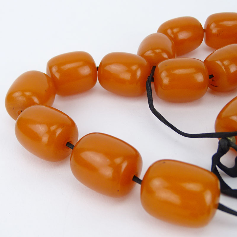 Three (3) Vintage Amber Bead Necklaces together with One Pair of Amber Earrings