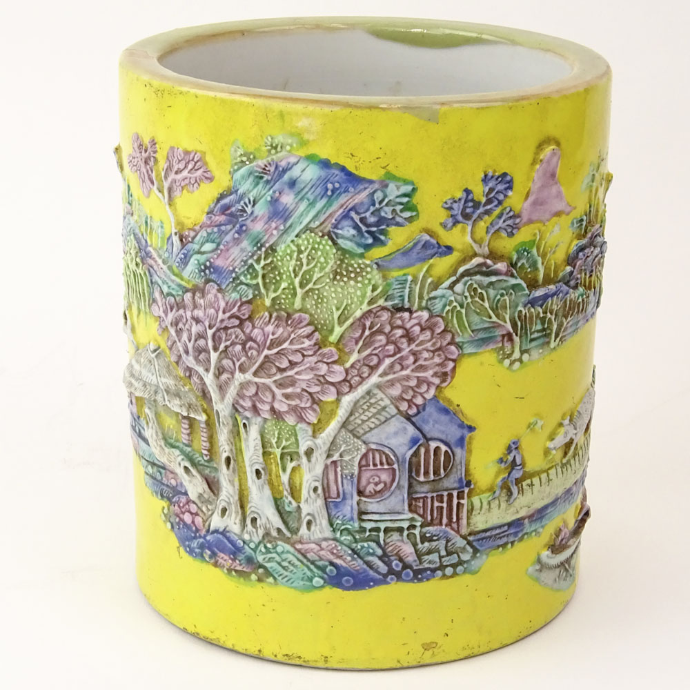 Chinese Guangxu (1875-1908) Famille Jaune Porcelain Brush Pot with Molded Relief Decoration Depicting a Mountain Village Landscape