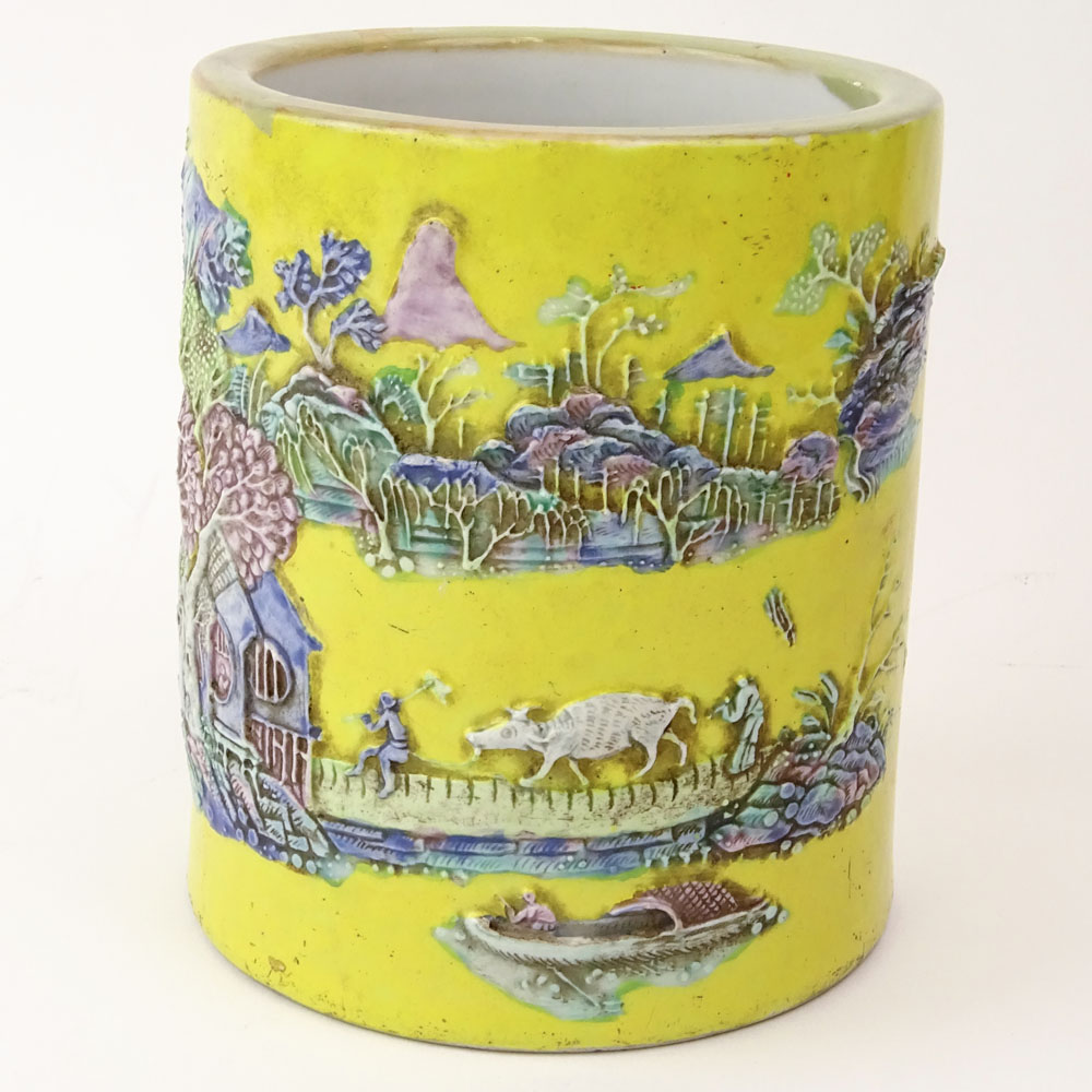 Chinese Guangxu (1875-1908) Famille Jaune Porcelain Brush Pot with Molded Relief Decoration Depicting a Mountain Village Landscape