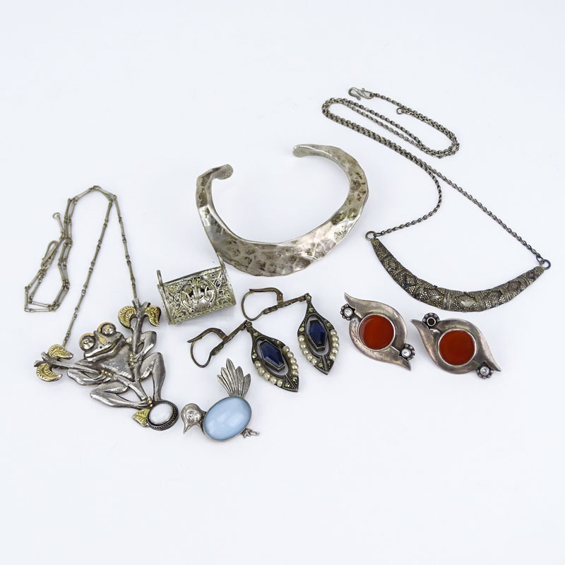 Miscellaneous Silver Lot Including Two (2) Marked 925 Necklaces, One (1) Marked 925 Bangle Bracelet, One (1) Sterling Marked Bird Brooch, One (1) 90% Marked Pendant, Unmarked Silver and Carnelian Earrings, Unmarked Silver, Seed Pearl, Marcasite Earrings