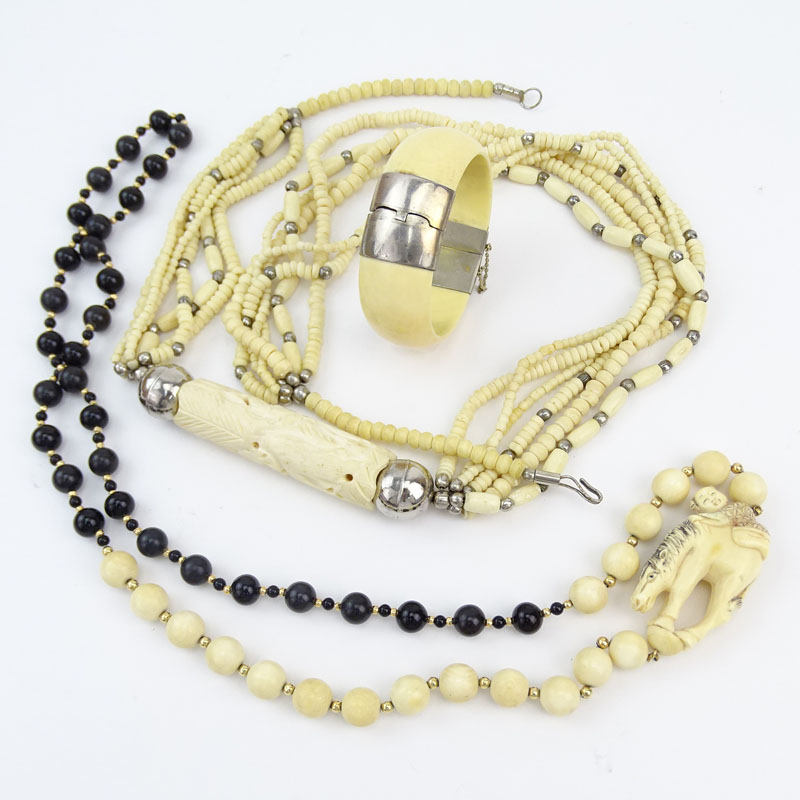 Three Piece Lot Including Carved and Black Onyx Bead Necklace, Carved Bone Necklace and Bangle Bracelet